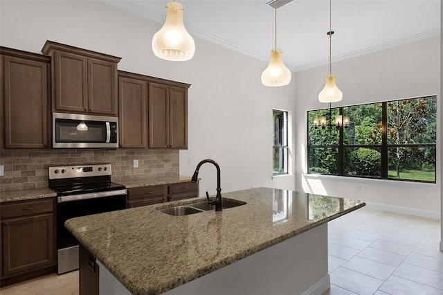 9220 San Jose Blvd, Howey In The Hills, FL 34737 - kitchen with stainless steel appliances, a sink, tasteful backsplash, light stone countertops, and crown molding