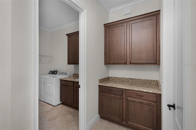 9220 San Jose Blvd, Howey In The Hills, FL 34737 - laundry room with ornamental molding, independent washer and dryer, cabinet space, and light tile patterned flooring