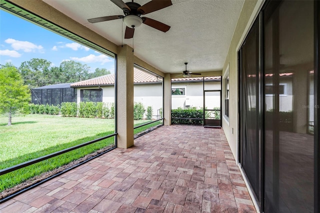 9220 San Jose Blvd, Howey In The Hills, FL 34737 - unfurnished sunroom featuring ceiling fan