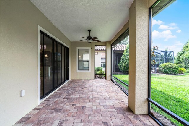 9220 San Jose Blvd, Howey In The Hills, FL 34737 - unfurnished sunroom with ceiling fan
