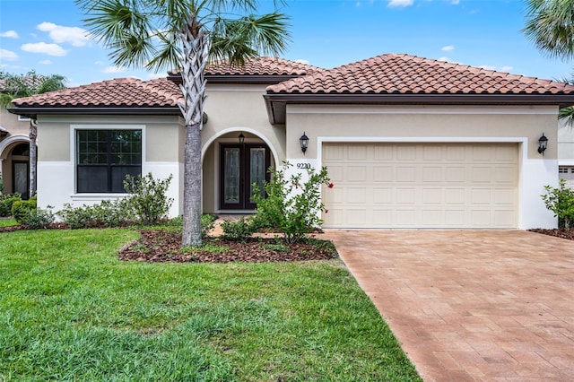 9220 San Jose Blvd, Howey In The Hills, FL 34737 - mediterranean / spanish-style home featuring french doors, decorative driveway, stucco siding, and a front lawn
