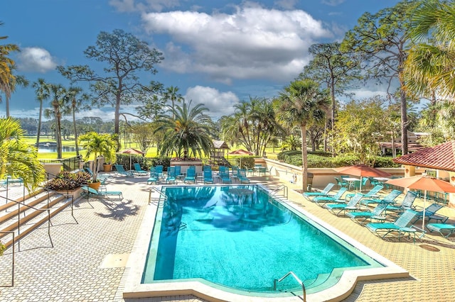 9220 San Jose Blvd, Howey In The Hills, FL 34737 - community pool featuring a patio
