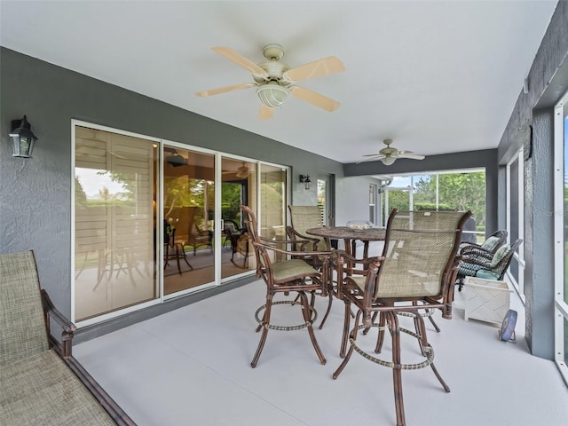 654 Poinsett Ct, The Villages, FL 32162 - sunroom / solarium featuring a ceiling fan and outdoor dining space