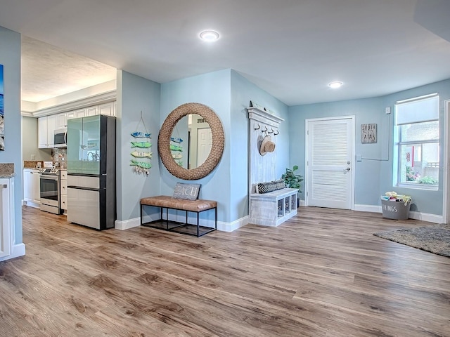 3425 S Atlantic Ave Unit 1101, Daytona Beach, FL 32118 - foyer entrance featuring baseboards, wood finished floors, and recessed lighting