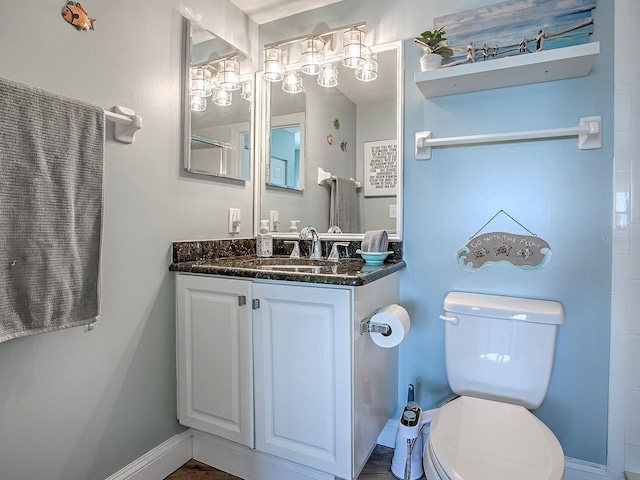3425 S Atlantic Ave Unit 1101, Daytona Beach, FL 32118 - bathroom featuring toilet, vanity, and baseboards