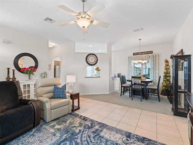 11019 SE 170th Lane Rd, Summerfield, FL 34491 - living area with light carpet, plenty of natural light, ceiling fan, and light tile patterned floors