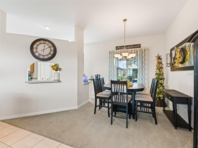 11019 SE 170th Lane Rd, Summerfield, FL 34491 - carpeted dining room with a chandelier, baseboards, and tile patterned flooring
