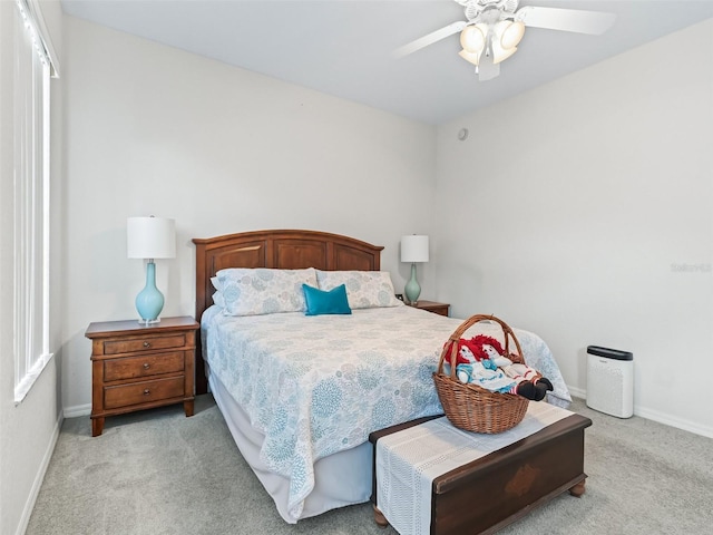 11019 SE 170th Lane Rd, Summerfield, FL 34491 - bedroom with light colored carpet, baseboards, and a ceiling fan