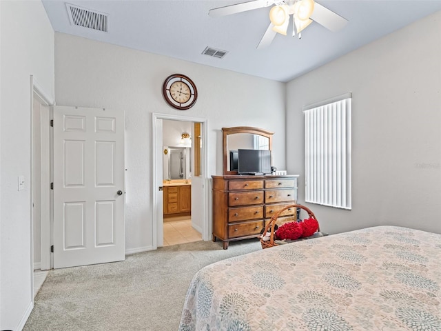 11019 SE 170th Lane Rd, Summerfield, FL 34491 - bedroom with carpet, ensuite bathroom, a ceiling fan, and baseboards