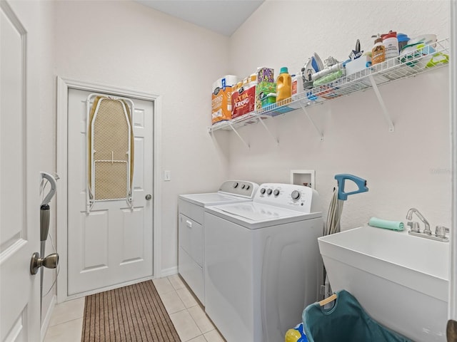 11019 SE 170th Lane Rd, Summerfield, FL 34491 - washroom with separate washer and dryer and light tile patterned floors
