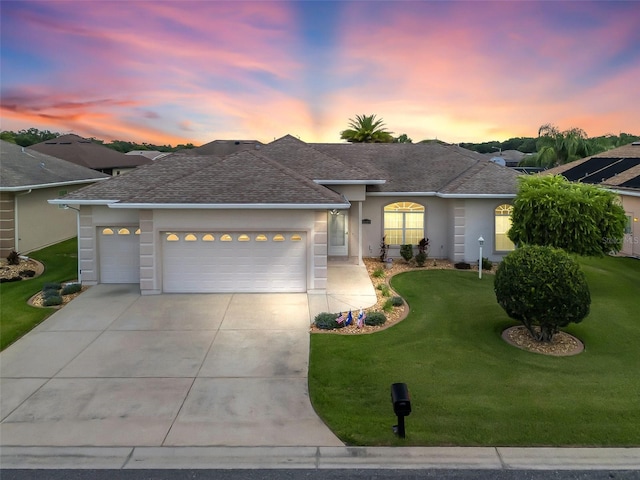 11019 SE 170th Lane Rd, Summerfield, FL 34491 - ranch-style home with a shingled roof, an attached garage, driveway, and a lawn