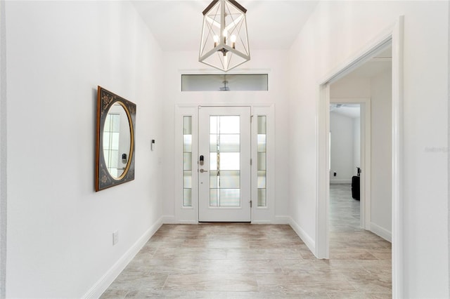 3769 Causey Ct, The Villages, FL 32163 - entrance foyer featuring a chandelier and baseboards