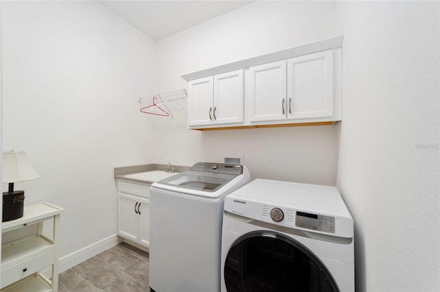 3769 Causey Ct, The Villages, FL 32163 - washroom with washer and clothes dryer, cabinet space, and baseboards