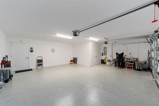 3769 Causey Ct, The Villages, FL 32163 - garage featuring electric panel, a garage door opener, and baseboards