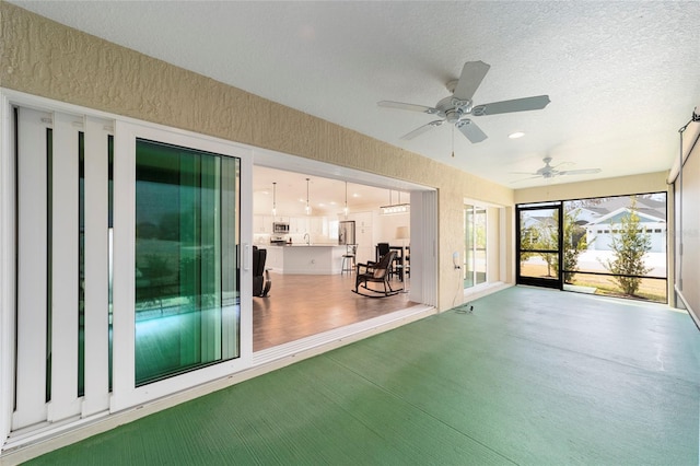 3769 Causey Ct, The Villages, FL 32163 - unfurnished sunroom featuring ceiling fan and a sink