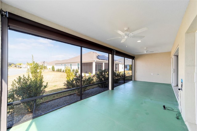3769 Causey Ct, The Villages, FL 32163 - unfurnished sunroom featuring ceiling fan