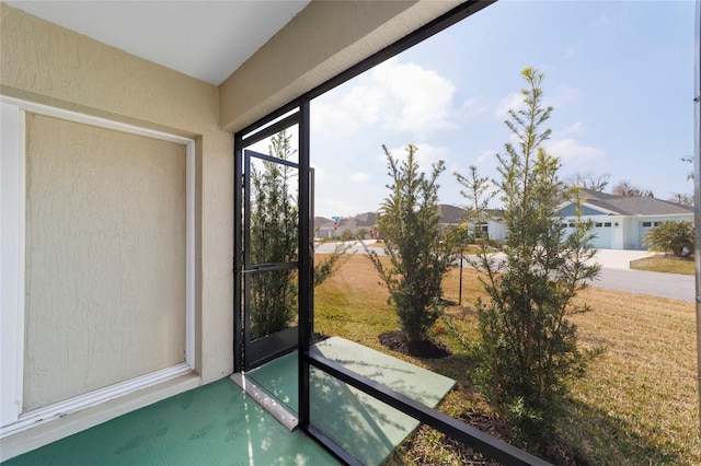 3769 Causey Ct, The Villages, FL 32163 - unfurnished sunroom featuring a residential view