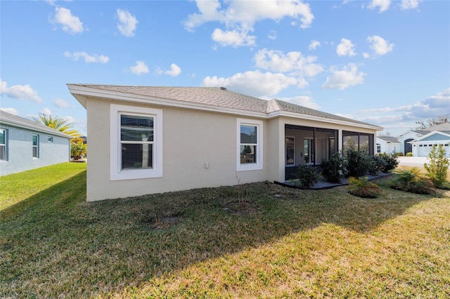 3769 Causey Ct, The Villages, FL 32163 - back of property with a yard, stucco siding, and a sunroom