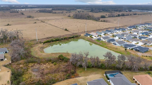 3769 Causey Ct, The Villages, FL 32163 - aerial view of property's location featuring a large body of water and nearby suburban area