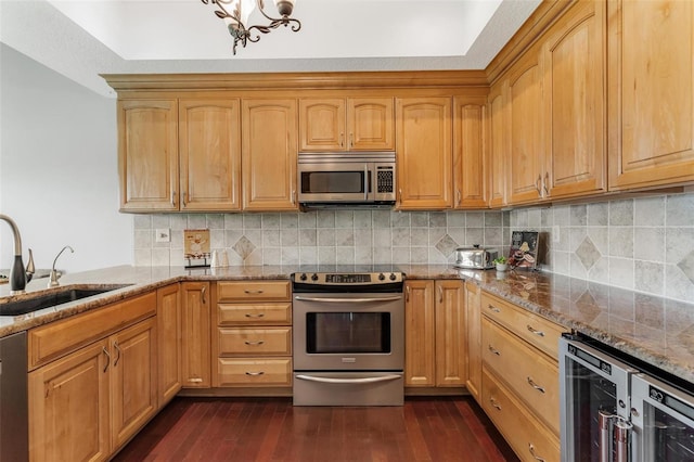 6048 Topsail Rd, Lady Lake, FL 32159 - kitchen with appliances with stainless steel finishes, beverage cooler, dark wood-style floors, stone countertops, and decorative backsplash