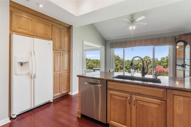 6048 Topsail Rd, Lady Lake, FL 32159 - kitchen featuring white refrigerator with ice dispenser, dishwasher, dark wood-style floors, dark stone counters, and lofted ceiling