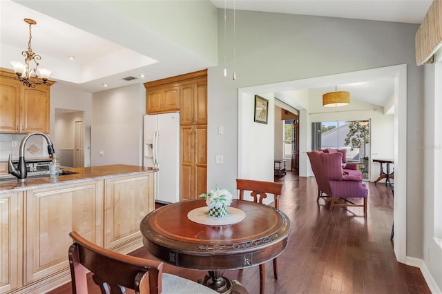 6048 Topsail Rd, Lady Lake, FL 32159 - dining area with dark wood-style floors, vaulted ceiling, a chandelier, and recessed lighting