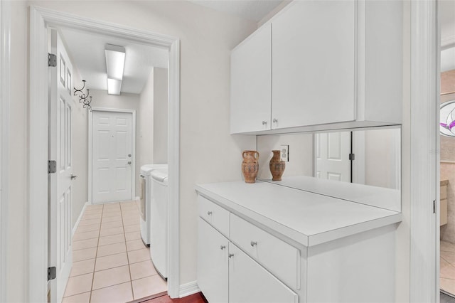 6048 Topsail Rd, Lady Lake, FL 32159 - laundry room with washing machine and clothes dryer and light tile patterned floors