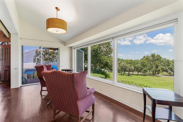 6048 Topsail Rd, Lady Lake, FL 32159 - dining room featuring dark wood-style flooring, lofted ceiling, and a sunroom
