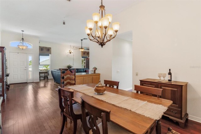 6048 Topsail Rd, Lady Lake, FL 32159 - dining area featuring dark wood finished floors, a chandelier, and ceiling fan