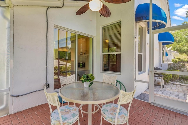 6048 Topsail Rd, Lady Lake, FL 32159 - sunroom featuring a ceiling fan and outdoor dining space