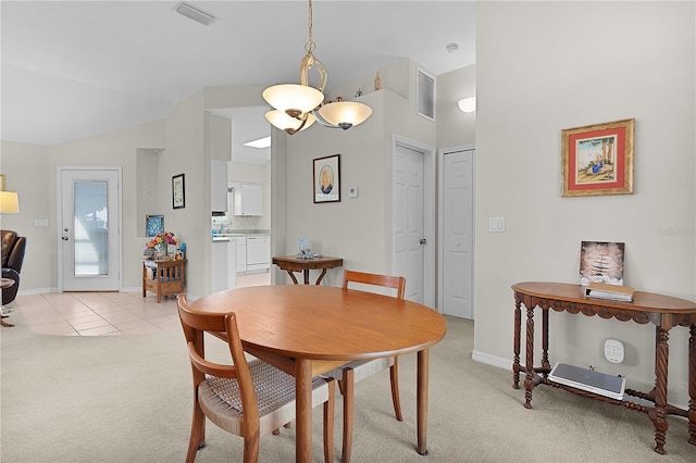 2821 Mediterranean Loop, Tavares, FL 32778 - dining space with light colored carpet, baseboards, lofted ceiling, and light tile patterned flooring
