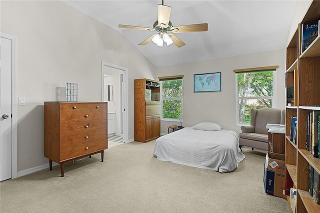 2821 Mediterranean Loop, Tavares, FL 32778 - carpeted bedroom featuring vaulted ceiling, baseboards, ensuite bathroom, and a ceiling fan