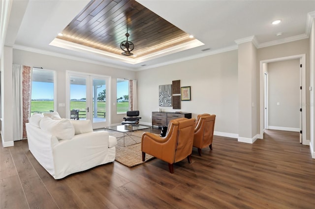 1127 Fiesta Key Cir, Lady Lake, FL 32159 - living room with a raised ceiling, dark wood finished floors, baseboards, ornamental molding, and recessed lighting