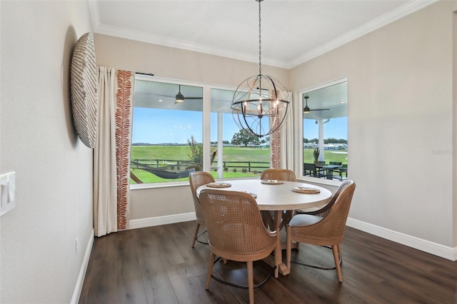 1127 Fiesta Key Cir, Lady Lake, FL 32159 - dining area with baseboards, a chandelier, wood finished floors, plenty of natural light, and ornamental molding