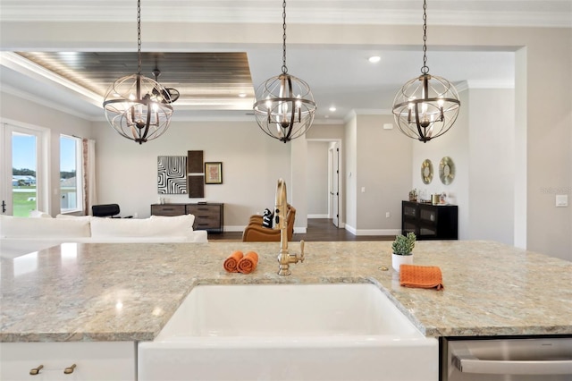 1127 Fiesta Key Cir, Lady Lake, FL 32159 - kitchen with a chandelier, open floor plan, a sink, dishwasher, and light stone counters