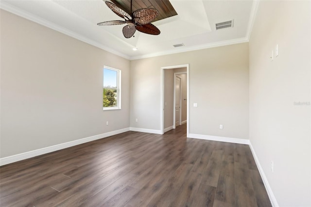 1127 Fiesta Key Cir, Lady Lake, FL 32159 - empty room with a raised ceiling, a ceiling fan, dark wood finished floors, crown molding, and baseboards