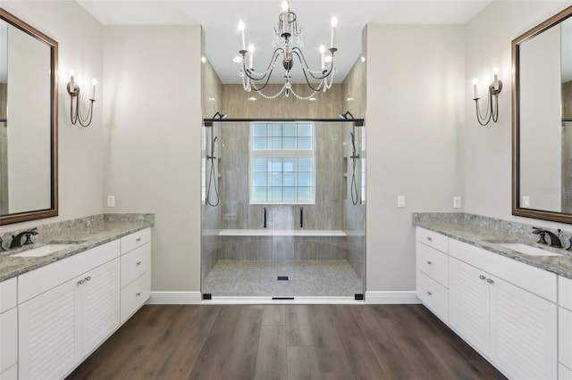 1127 Fiesta Key Cir, Lady Lake, FL 32159 - bathroom featuring baseboards, a chandelier, wood finished floors, a shower stall, and recessed lighting