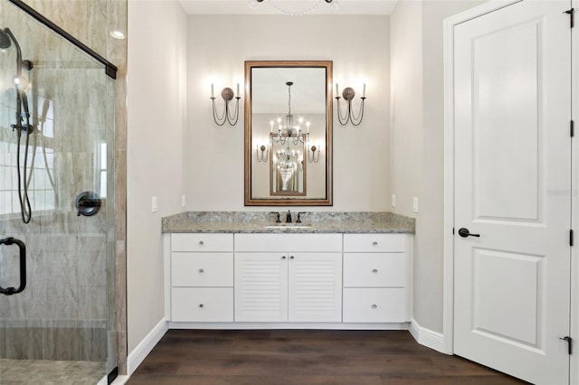 1127 Fiesta Key Cir, Lady Lake, FL 32159 - full bathroom with a stall shower, baseboards, vanity, and wood finished floors
