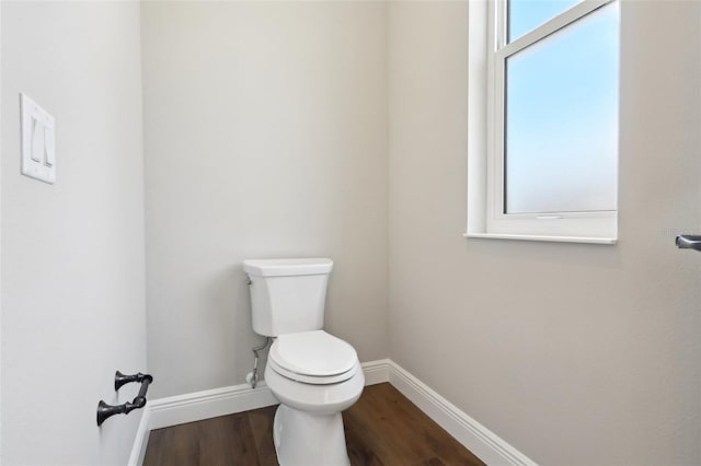 1127 Fiesta Key Cir, Lady Lake, FL 32159 - bathroom with baseboards, wood finished floors, and toilet