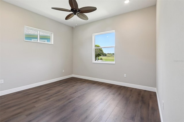 1127 Fiesta Key Cir, Lady Lake, FL 32159 - spare room featuring plenty of natural light, dark wood-style flooring, baseboards, and recessed lighting