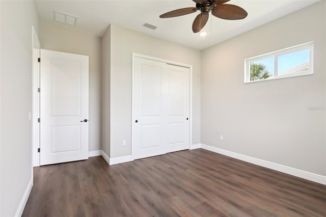 1127 Fiesta Key Cir, Lady Lake, FL 32159 - unfurnished bedroom with dark wood-style flooring, baseboards, a closet, and recessed lighting