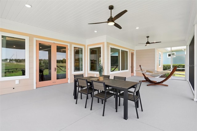 1127 Fiesta Key Cir, Lady Lake, FL 32159 - view of patio featuring a ceiling fan, outdoor dining space, and french doors