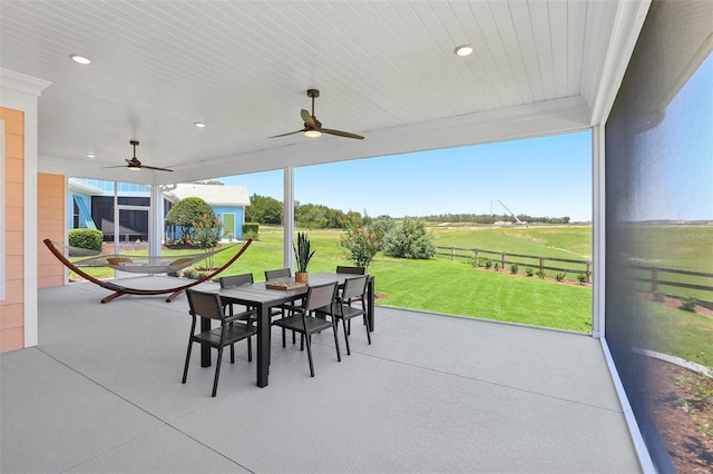 1127 Fiesta Key Cir, Lady Lake, FL 32159 - view of patio with outdoor dining space and ceiling fan