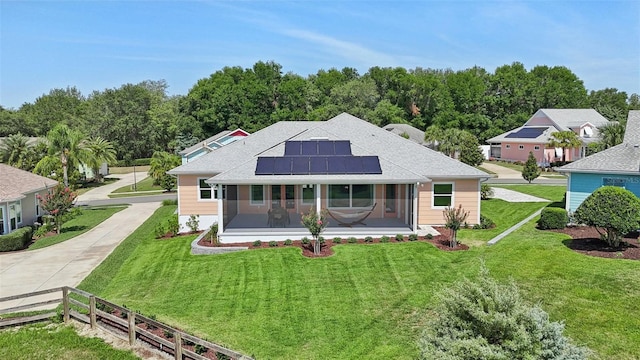 1127 Fiesta Key Cir, Lady Lake, FL 32159 - back of house featuring roof mounted solar panels