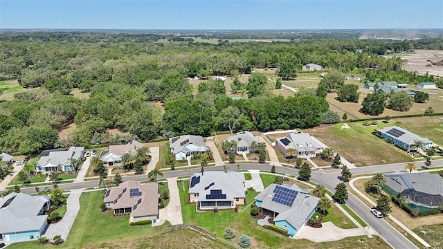 1127 Fiesta Key Cir, Lady Lake, FL 32159 - aerial view of property's location featuring nearby suburban area and a heavily wooded area