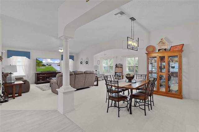 2738 Morven Park Way, The Villages, FL 32162 - carpeted dining area with ornate columns, a ceiling fan, a chandelier, and wood finished floors
