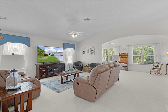 2738 Morven Park Way, The Villages, FL 32162 - living room with carpet floors, a ceiling fan, and vaulted ceiling