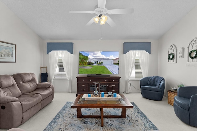 2738 Morven Park Way, The Villages, FL 32162 - carpeted living area with plenty of natural light, a textured ceiling, and ceiling fan