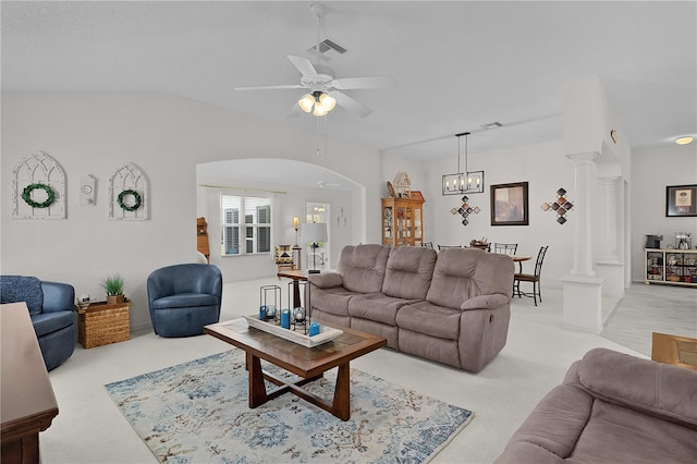 2738 Morven Park Way, The Villages, FL 32162 - living room with light carpet, ornate columns, ceiling fan, a chandelier, and arched walkways