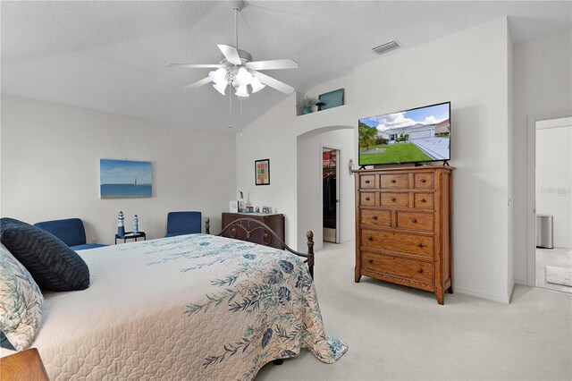 2738 Morven Park Way, The Villages, FL 32162 - carpeted bedroom featuring lofted ceiling, arched walkways, a ceiling fan, a textured ceiling, and baseboards